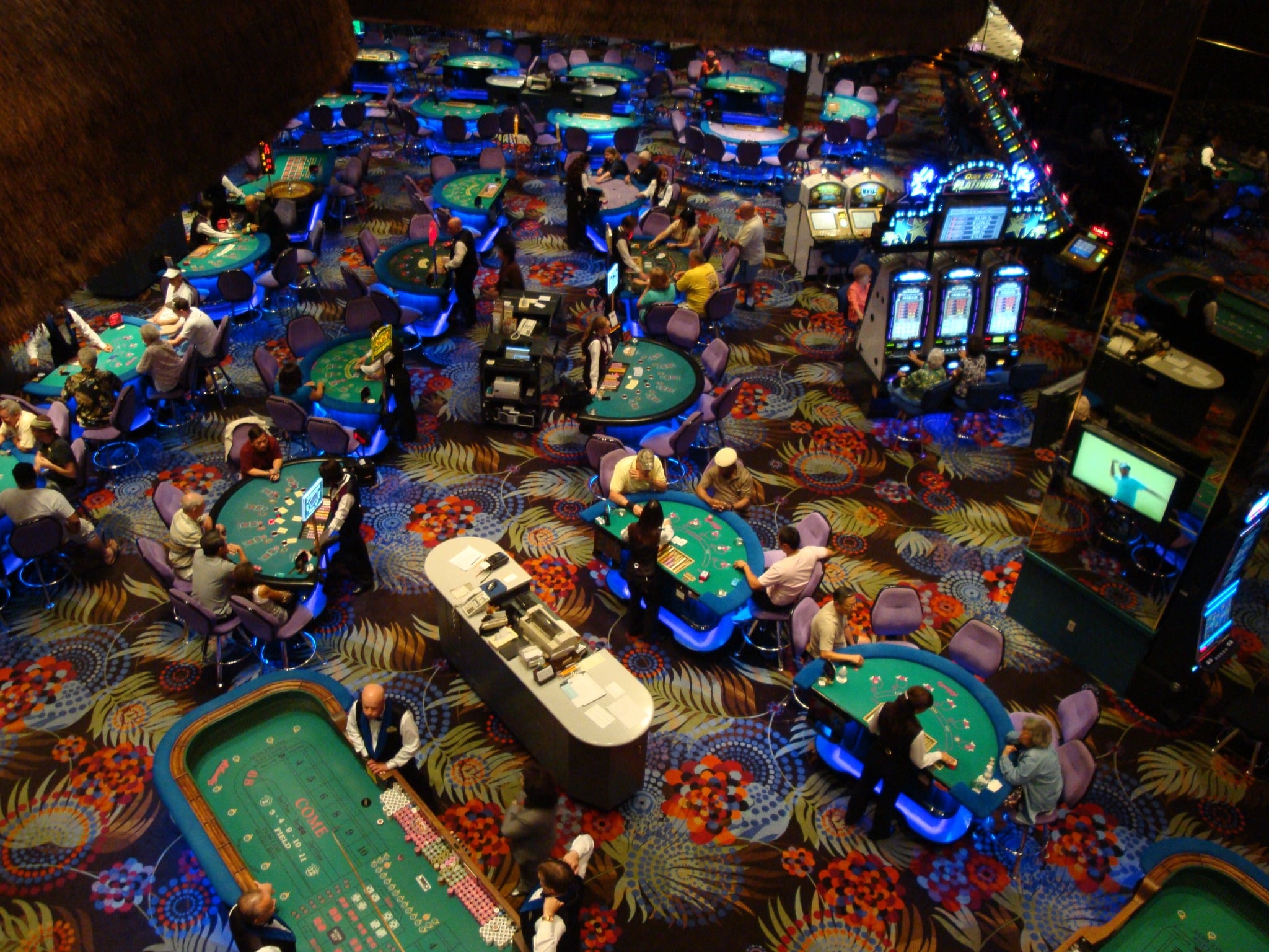 Gaming tables and slot machines on the casino floor at Atlantis Casino Resort Spa in Reno, Nevada.
