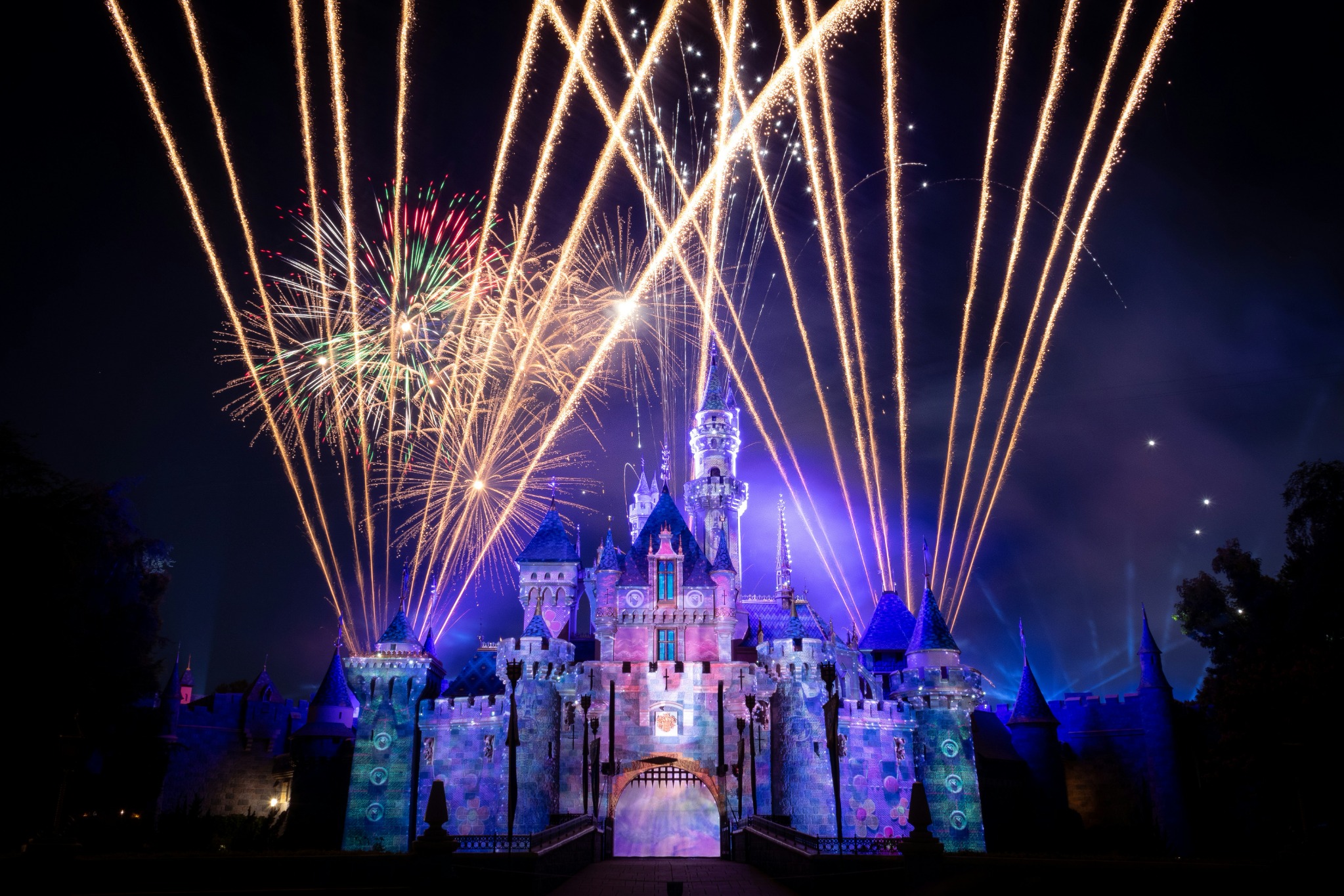 Nighttime fireworks show above Sleeping Beauty Castle at Disneyland