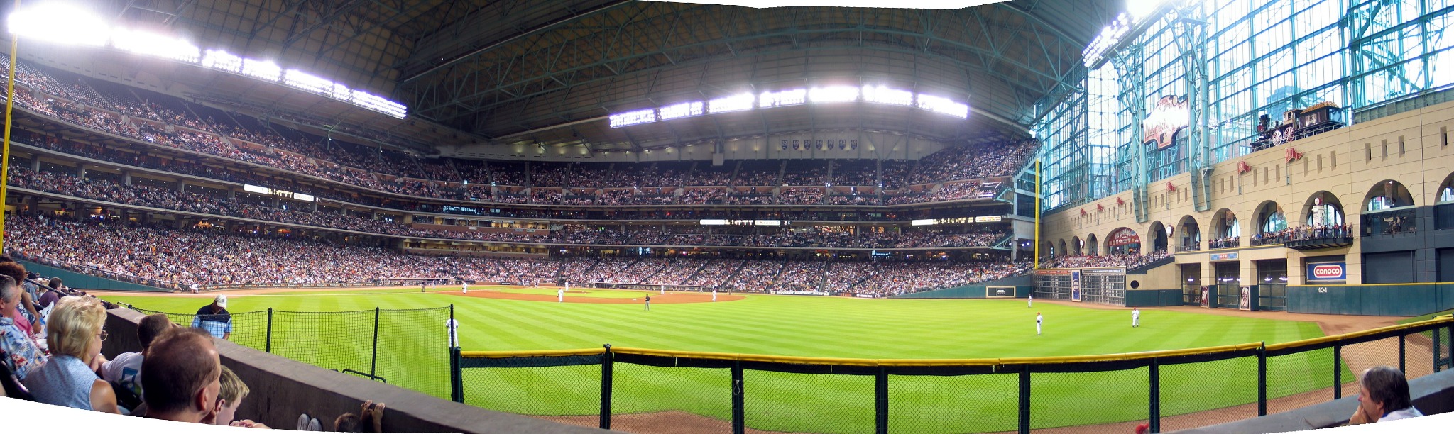 Panoramic interior view of Daikin Park baseball stadium in Houston during a game