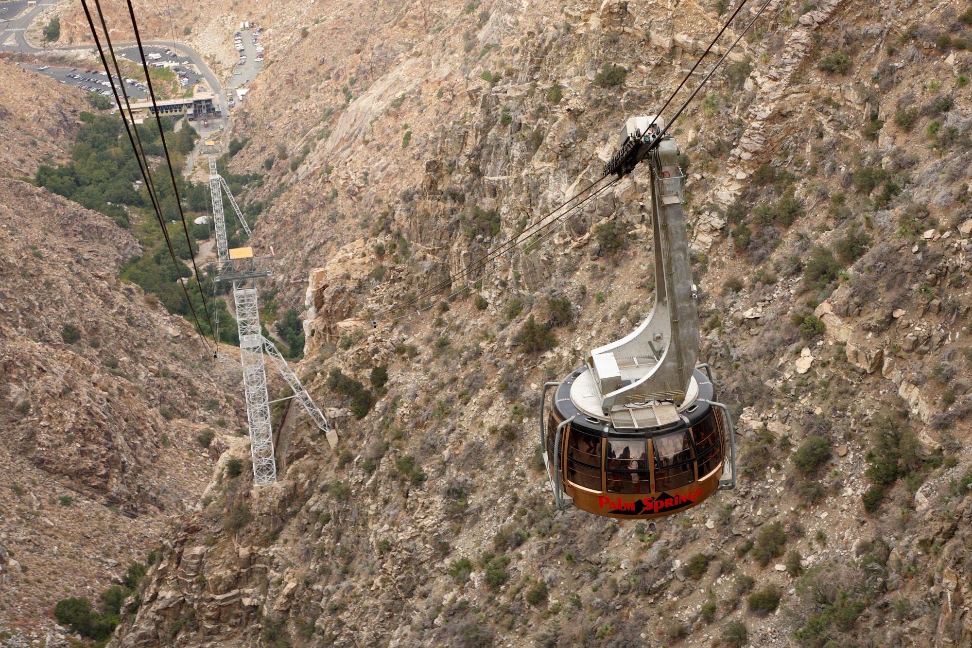 Palm Springs Aerial Tramway car traveling above the rocky Chino Canyon