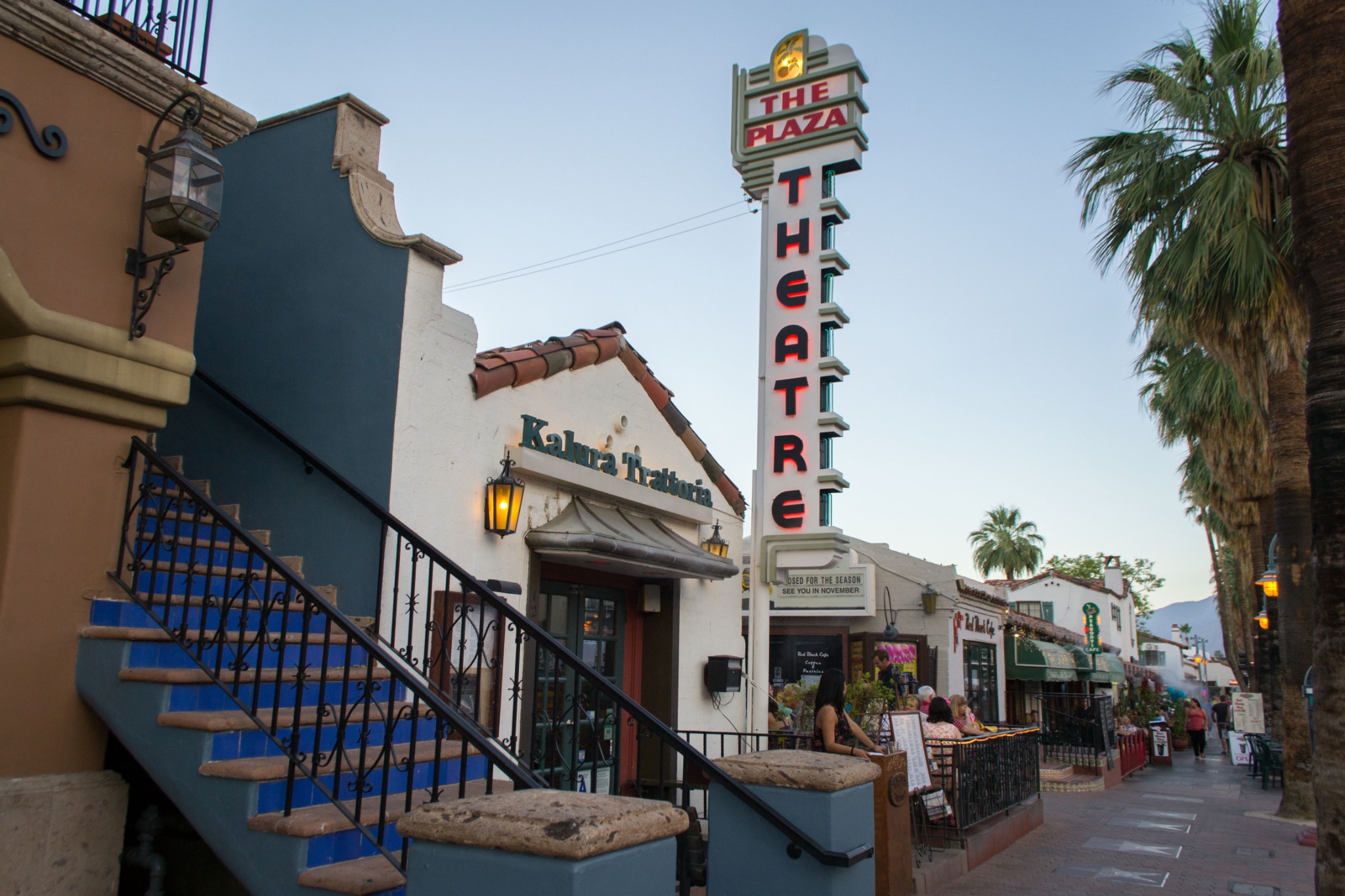 Historic Plaza Theatre sign and restaurants in downtown Palm Springs, California