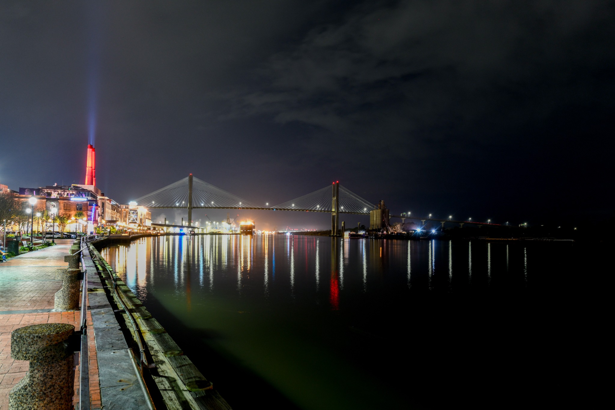 Night lights reflect across the Savannah River beneath the Talmadge Memorial Bridge.