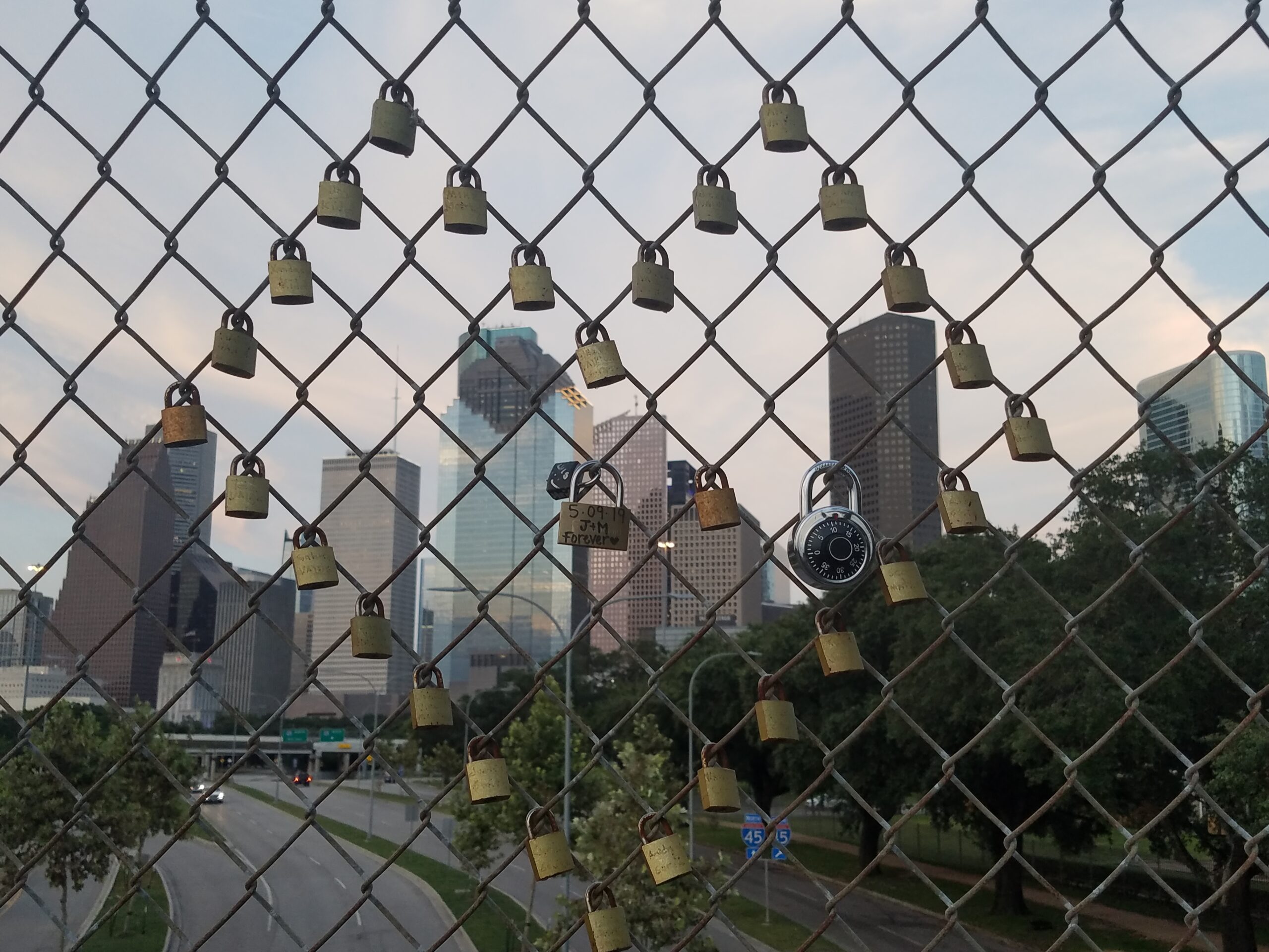 Locks of Love in a Heart Shape on Downtown Houston Fence . High quality photo